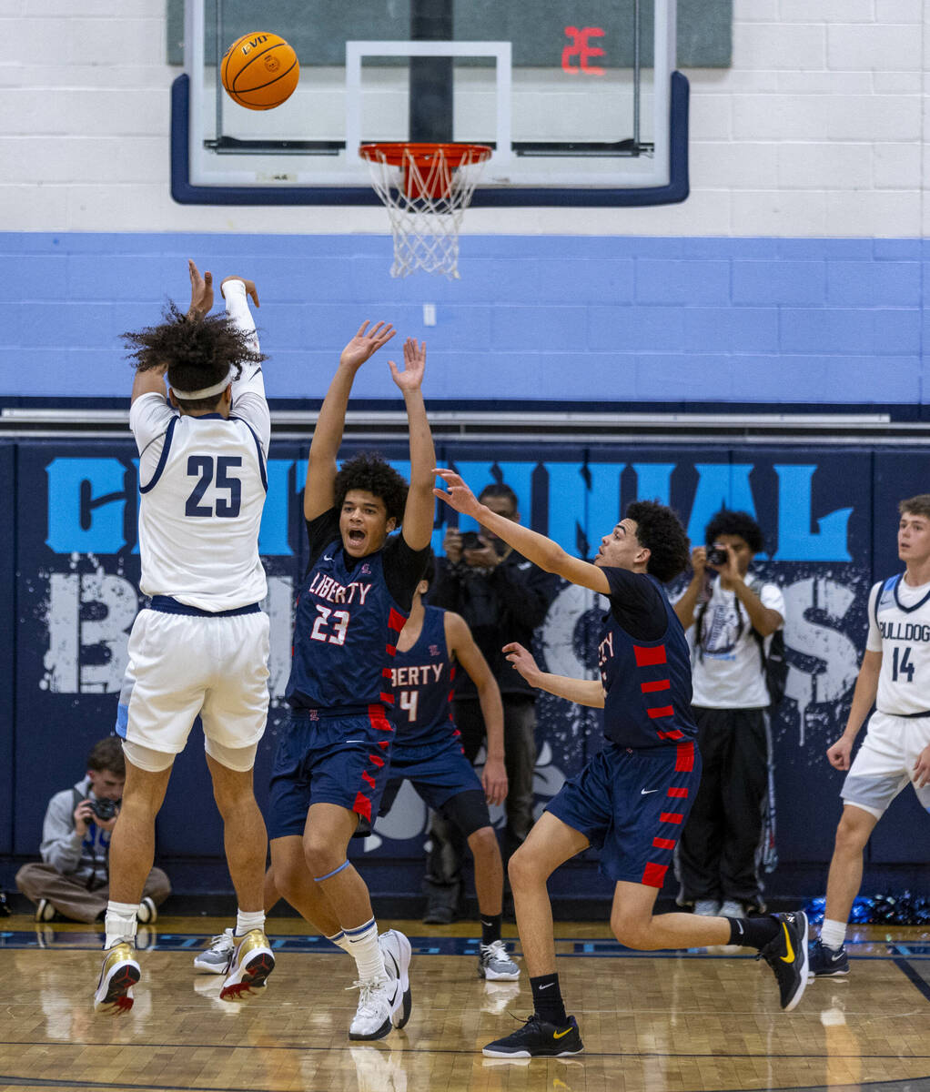 Centennial's Jayonni Durrough (25) posts up for a basket over Liberty's Maison Martin (23) duri ...