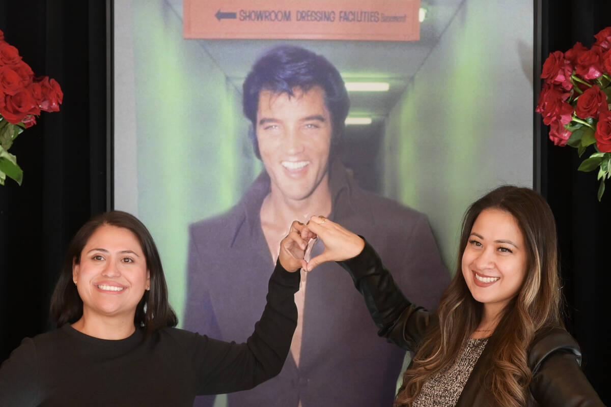 Ericka Alvarez, left, and Vanessa Lujan pose in front of a poster of Elvis Presley during a kic ...