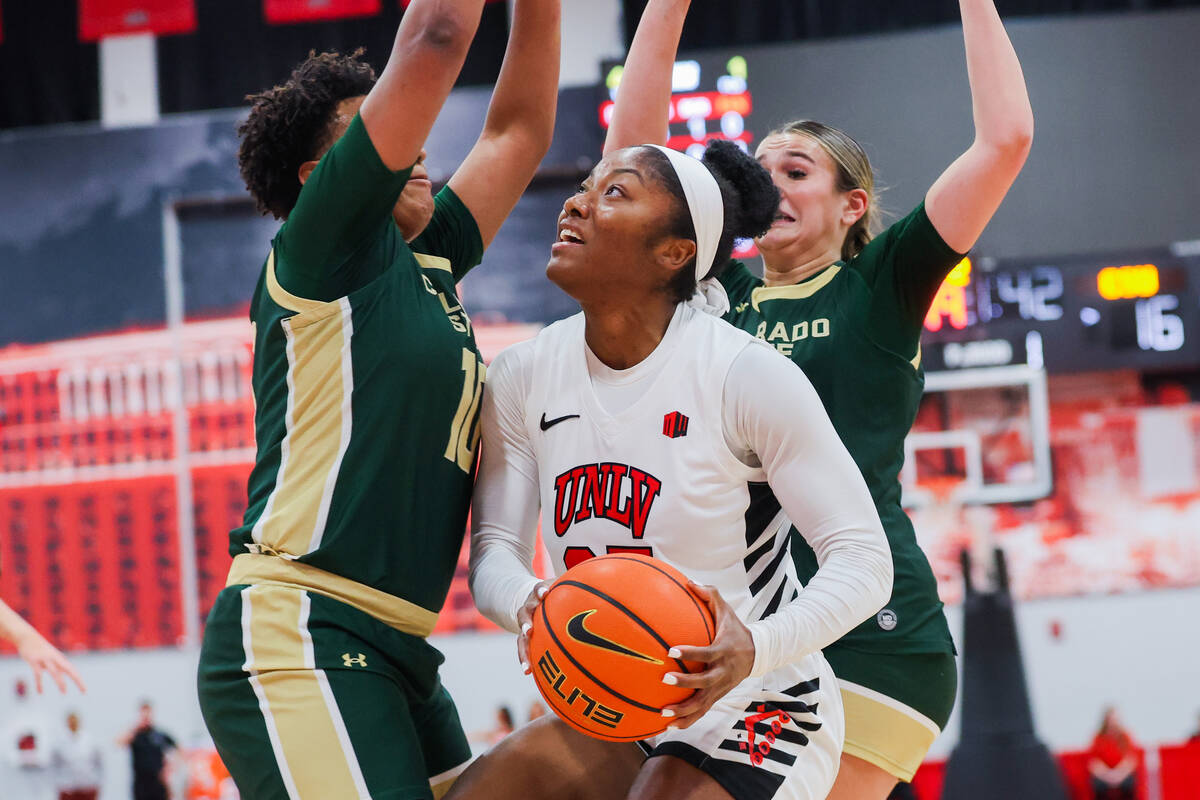 Lady Rebels guard Aaliyah Alexander (25) looks for an opening between against the Colorado Stat ...