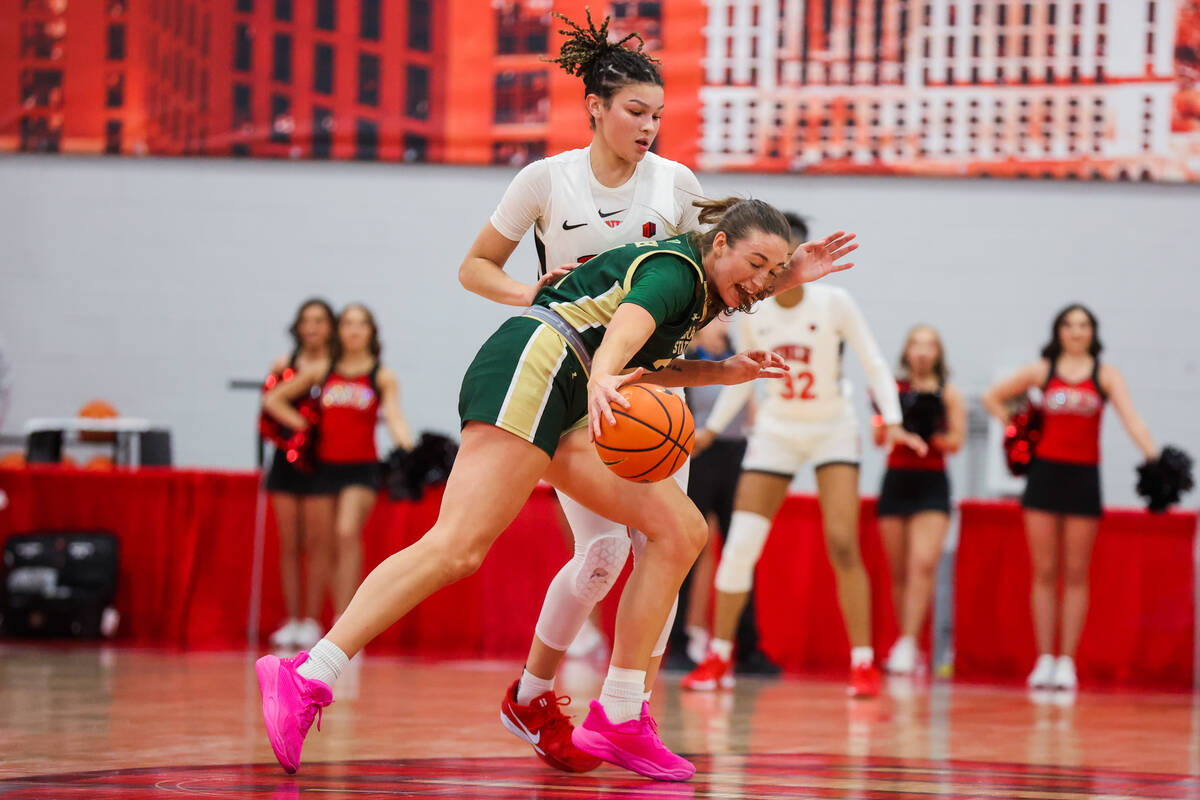 Colorado State Rams forward Emma Ronsiek (front) tries to work her way around Lady Rebels forwa ...