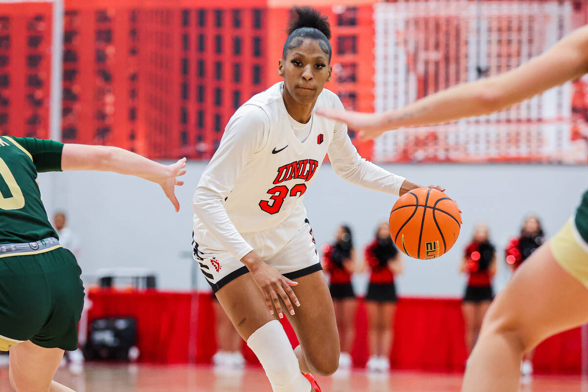 Lady Rebels forward Meadow Roland (32) dribbles the ball through Colorado State Rams defense du ...