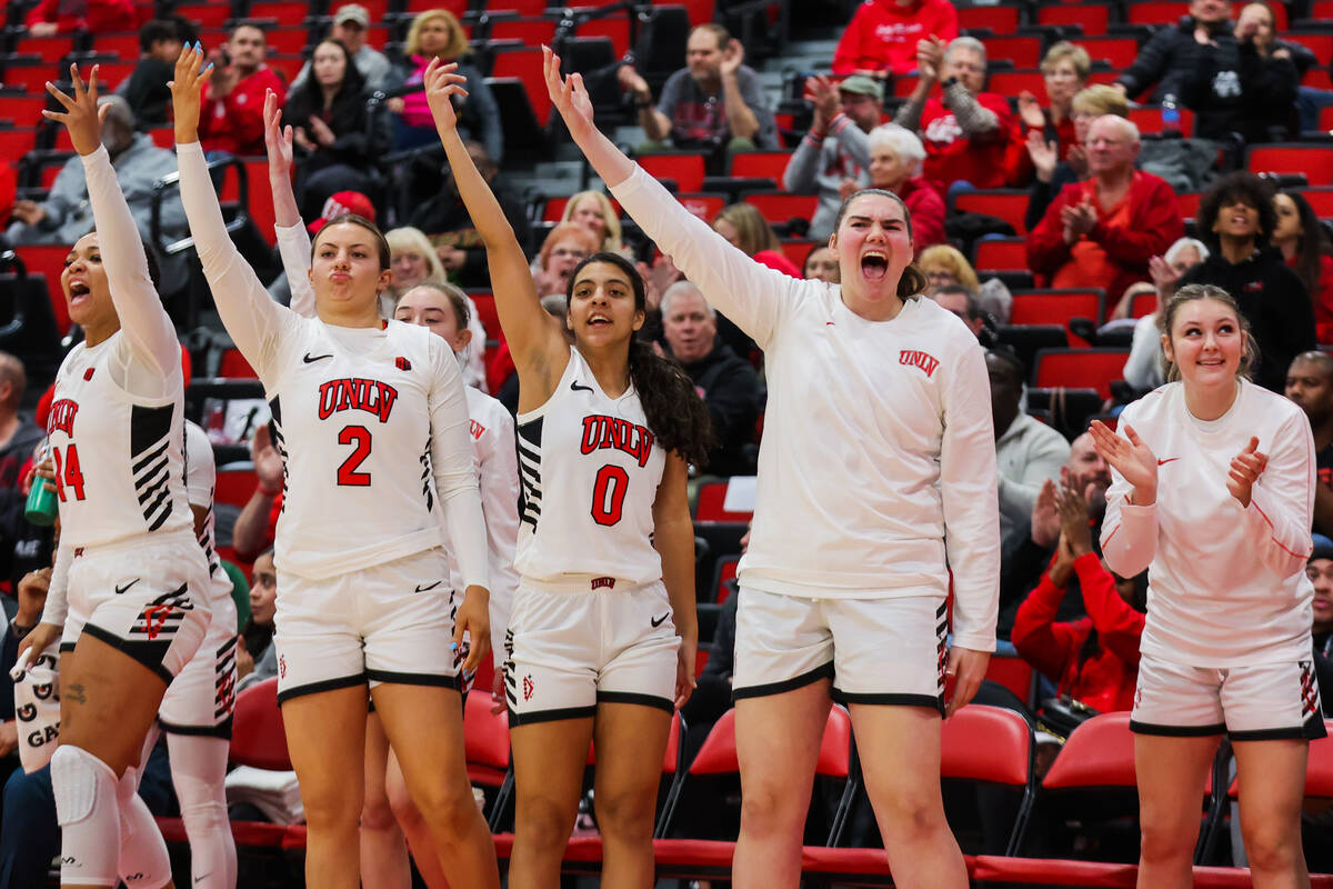 The Lady Rebels bench celebrates during an NCAA women’s basketball game between UNLV and ...