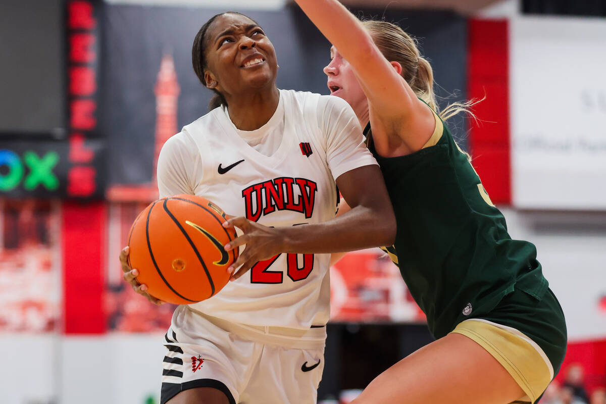 Lady Rebels forward Macie James (20) drives the ball to the basket while Colorado State Rams gu ...