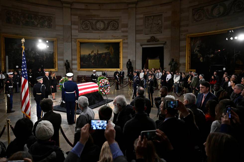 President elect Donald Trump and his wife Melania Trump visit the flag draped casket of the lat ...