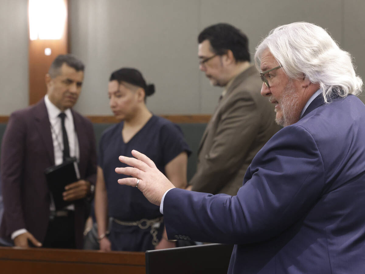 Scott Coffee, right, a public defender, representing Yoni Barrios, second left, addresses the c ...