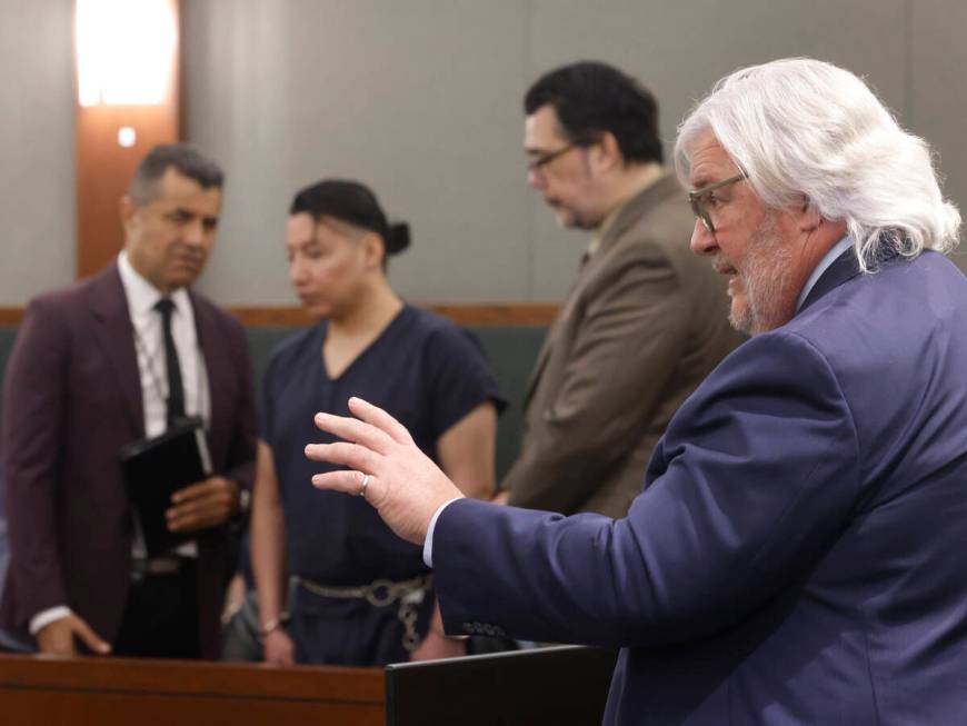 Scott Coffee, right, a public defender, representing Yoni Barrios, second left, addresses the c ...