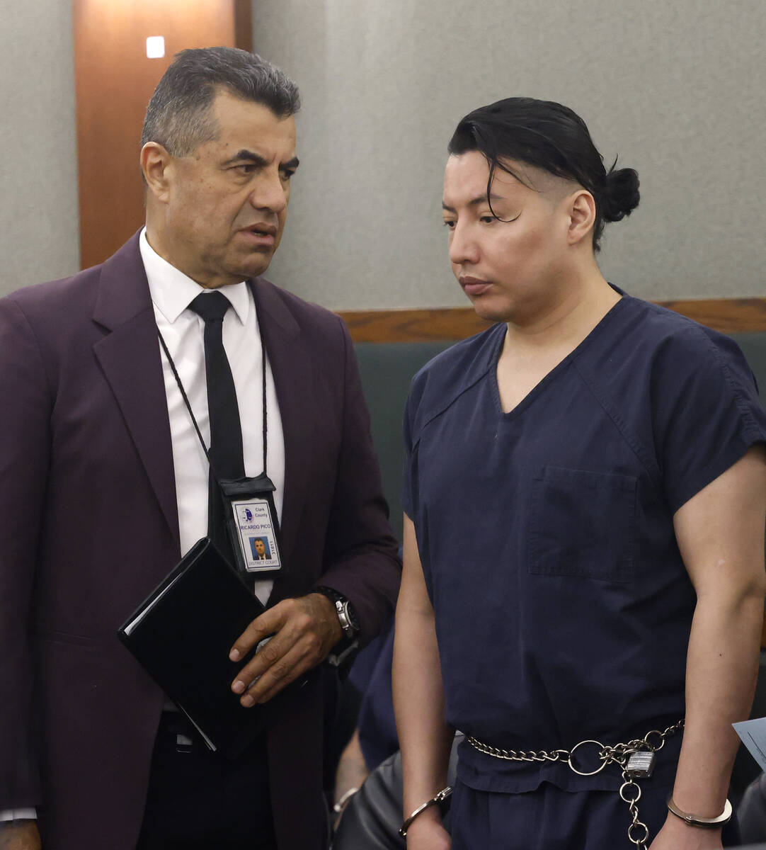 Yoni Barrios, right, listens to an interpreter during his arraignment at the Regional Justice C ...