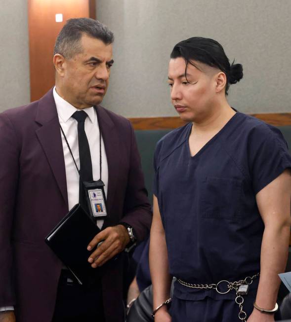 Yoni Barrios, right, listens to an interpreter during his arraignment at the Regional Justice C ...