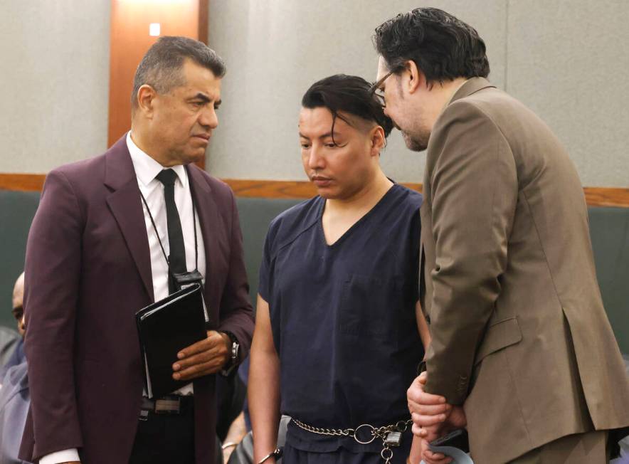 Yoni Barrios, center, listens to an interpreter and his attorney Jeff Maningo, right, during hi ...