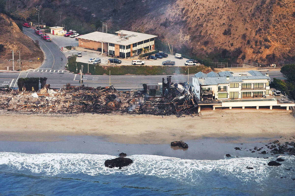 Beach front properties are left destroyed by the Palisades Fire, in this aerial view, Thursday, ...