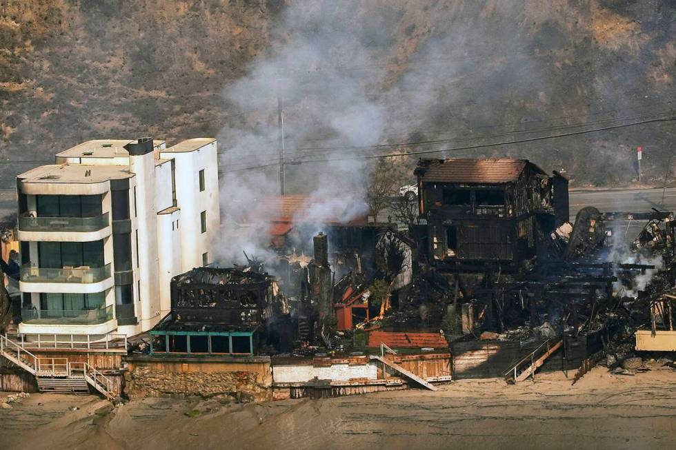 Beach front properties are left destroyed by the Palisades Fire, in this aerial view, Thursday, ...