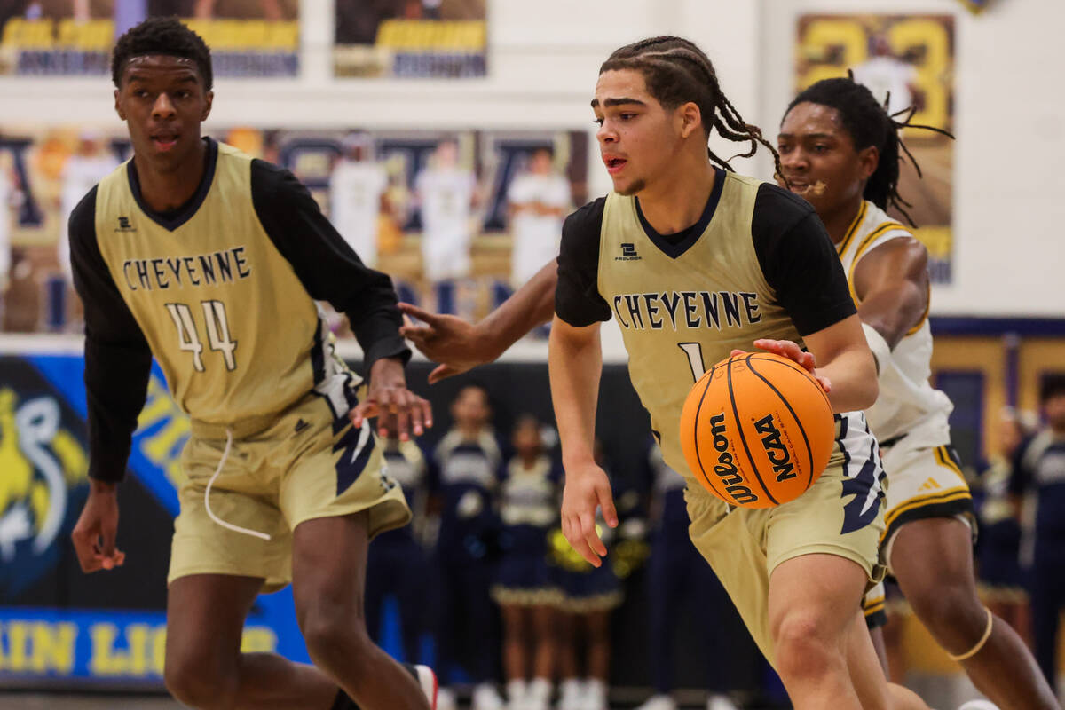 Cheyenne point guard Phoenix Dalton (1) dribbles the ball during a high school boys basketball ...