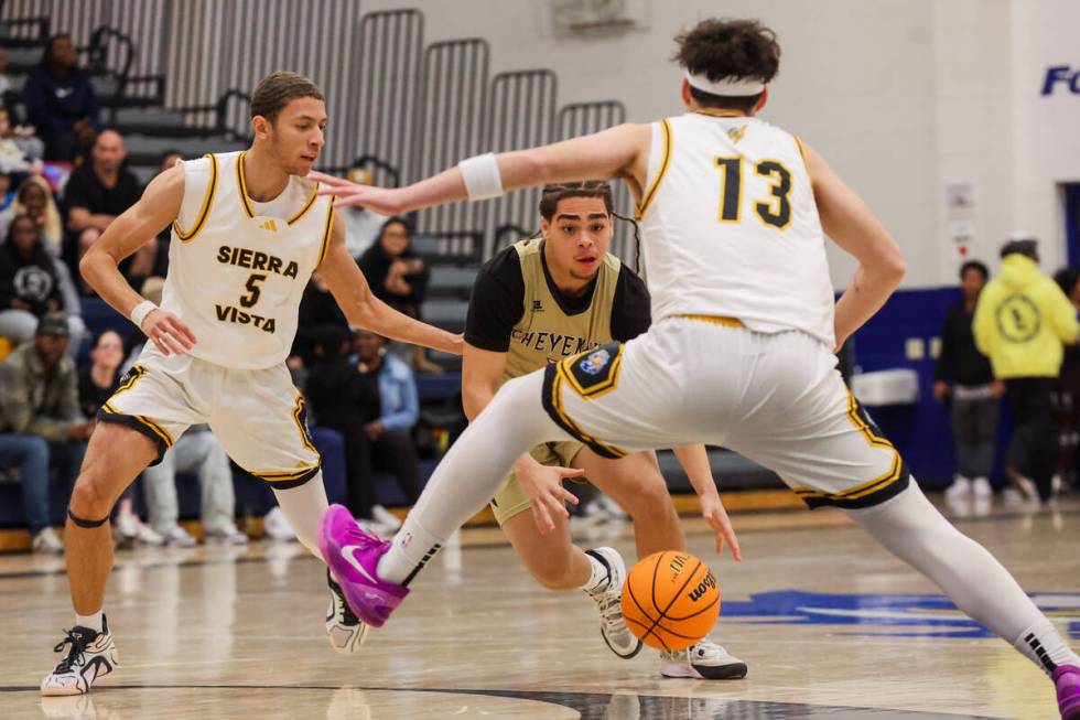 Cheyenne point guard Phoenix Dalton (1) drives the ball into Sierra Vista shooting guard Mark B ...