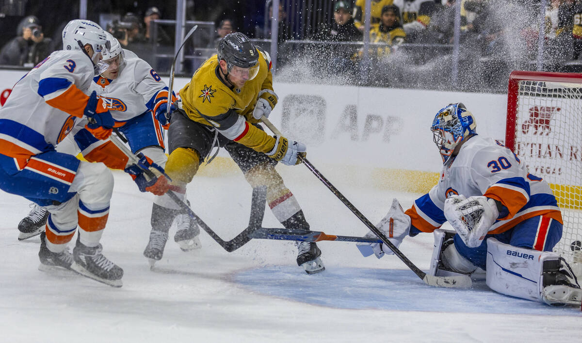 Golden Knights center Jack Eichel (9) takes a shot on goal against New York Islanders goaltende ...