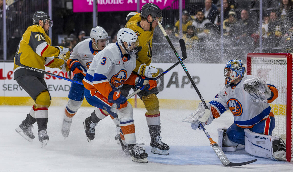 Golden Knights center Jack Eichel (9) takes a shot on goal against New York Islanders goaltende ...