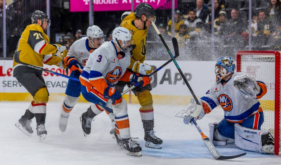 Golden Knights center Jack Eichel (9) takes a shot on goal against New York Islanders goaltende ...