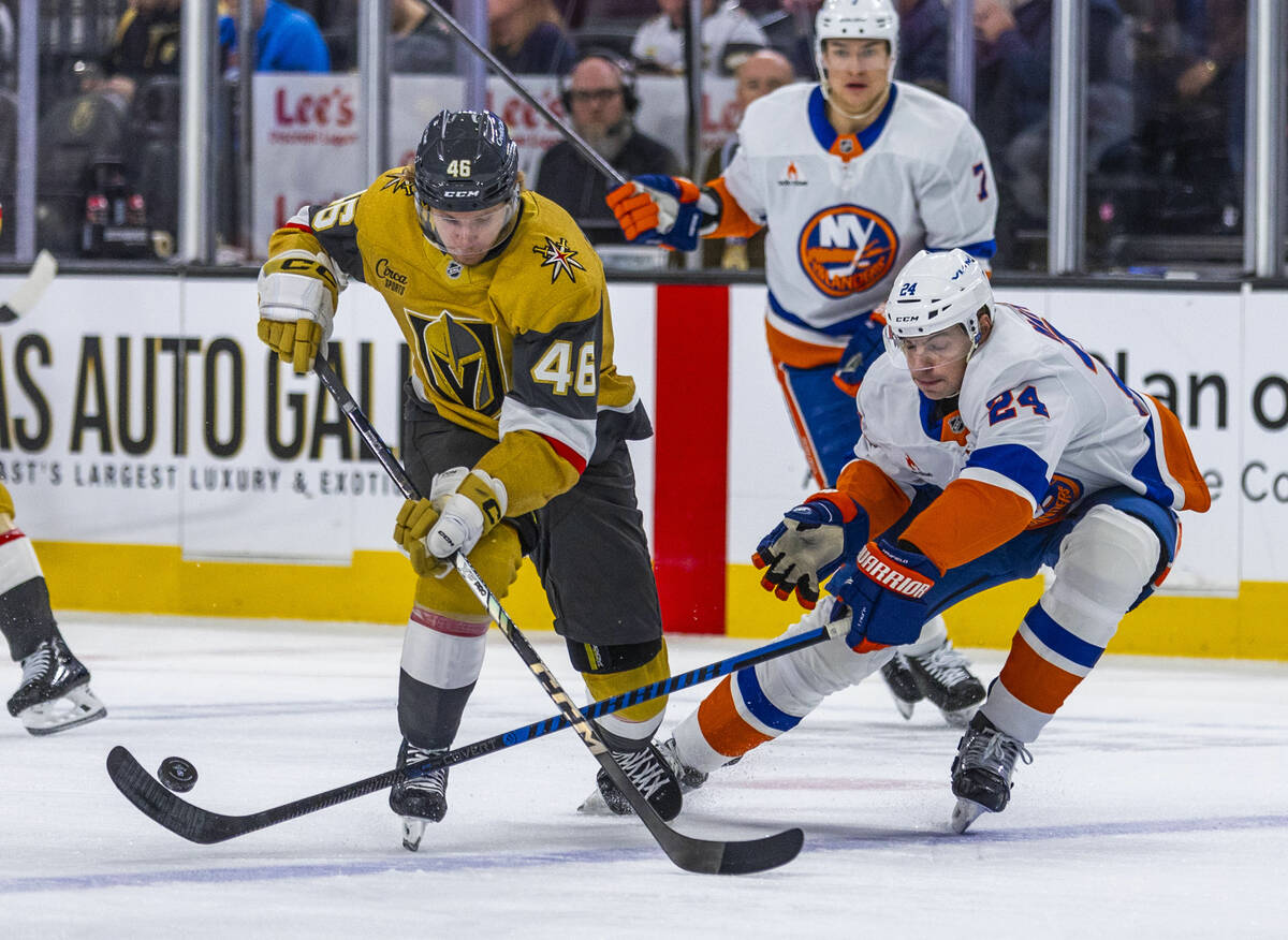 Golden Knights right wing Jonas Rondbjerg (46) has the puck taken away on a drive by New York I ...