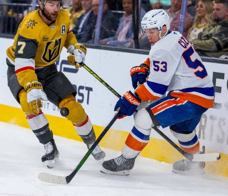 Golden Knights defenseman Alex Pietrangelo (7) eyes a puck as he looks for possession against N ...