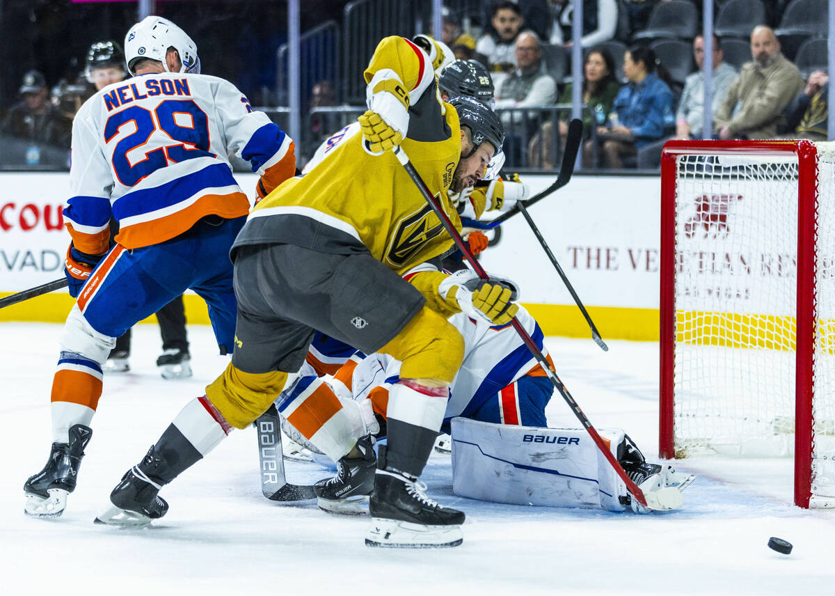 Golden Knights center Tomas Hertl (48) chases down a puck to shoot against New York Islanders g ...