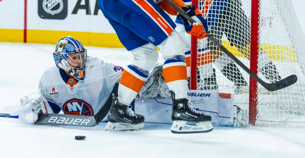 New York Islanders goaltender Ilya Sorokin (30) deflects a Golden Knights shot during the third ...