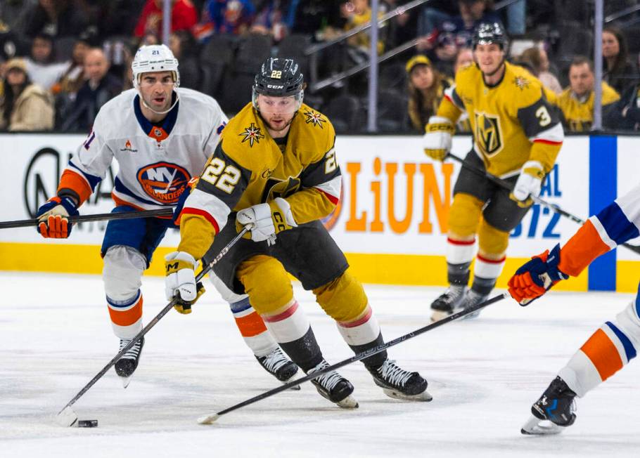 Golden Knights right wing Cole Schwindt (22) controls the puck past New York Islanders center K ...