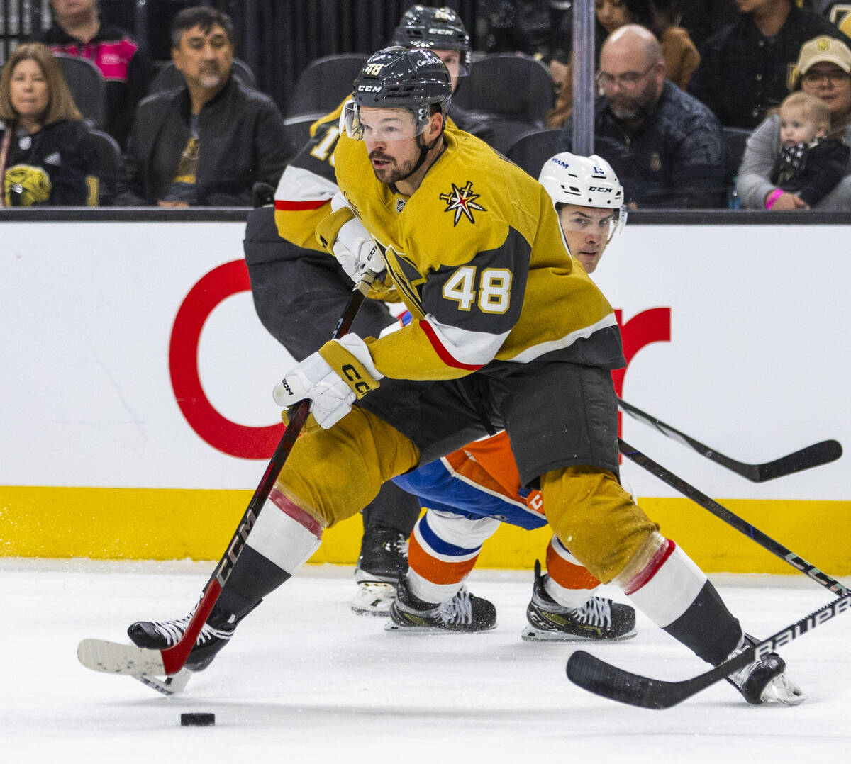 Golden Knights center Tomas Hertl (48) controls the puck past New York Islanders center Mathew ...