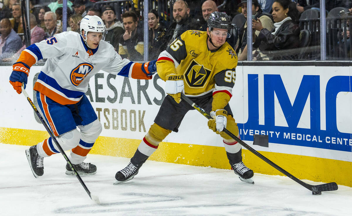 Golden Knights right wing Victor Olofsson (95) controls the puck over New York Islanders defens ...