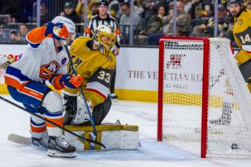 Golden Knights goaltender Adin Hill (33) watches as the puck rolls into the net against the New ...