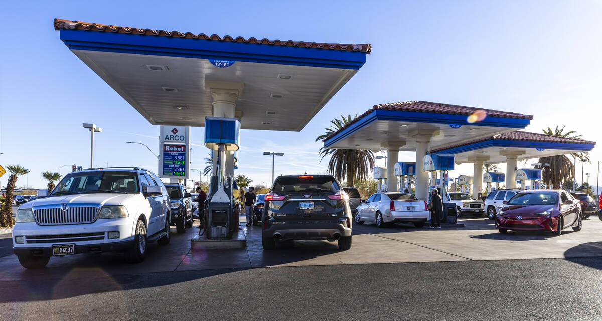 Customers fuel up at the Rebel gas station on North Buffalo Drive on Friday, Feb. 10, 2023, in ...