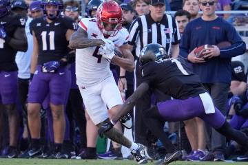 Arizona wide receiver Tetairoa McMillan (4) runs against TCU cornerback Channing Canada (7) dur ...