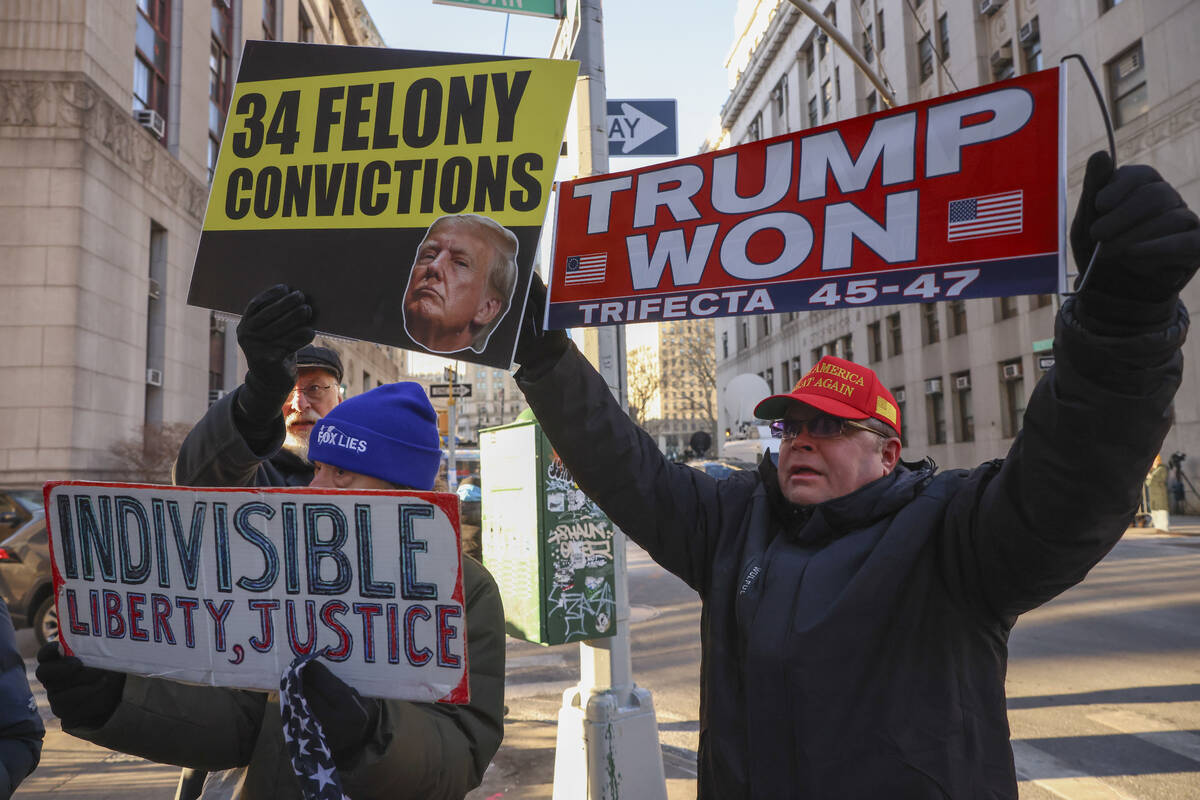 Demonstrators protest outside Manhattan criminal court before the start of the sentencing in Pr ...