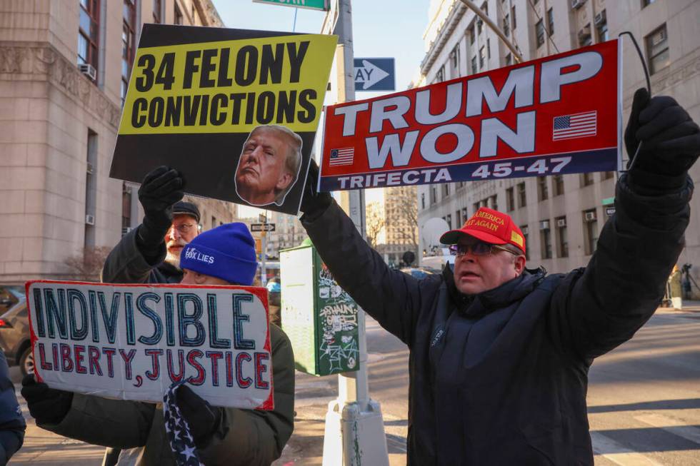 Demonstrators protest outside Manhattan criminal court before the start of the sentencing in Pr ...