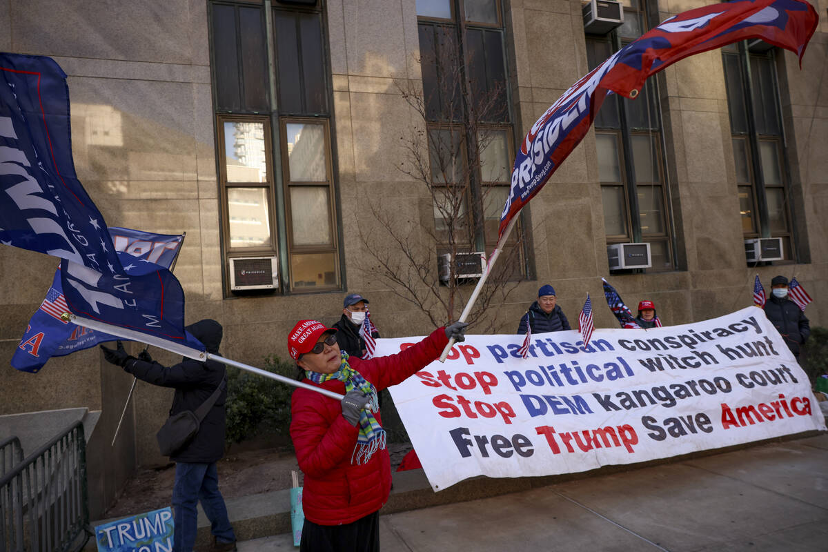 Demonstrators protest outside Manhattan criminal court before the start of the sentencing in Pr ...