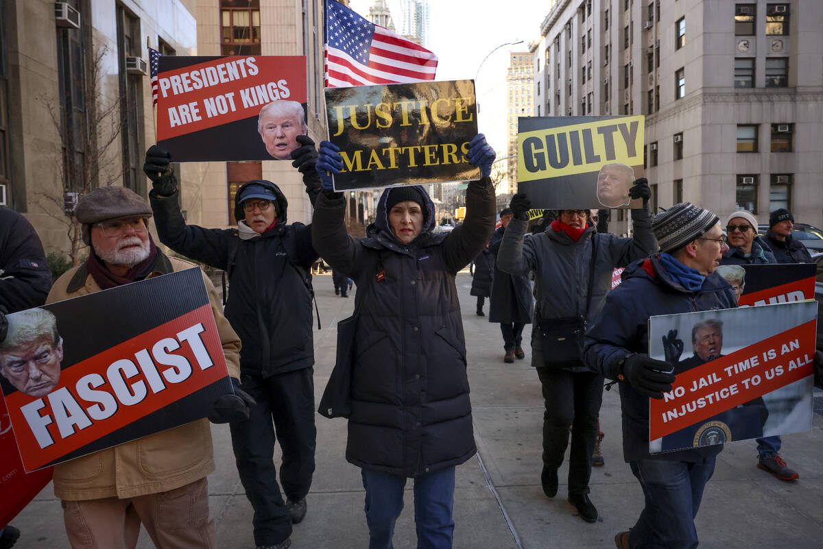 Demonstrators protest outside Manhattan criminal court before the start of the sentencing in Pr ...