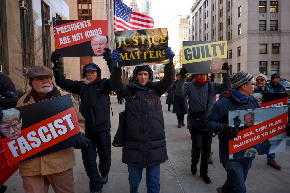 Demonstrators protest outside Manhattan criminal court before the start of the sentencing in Pr ...