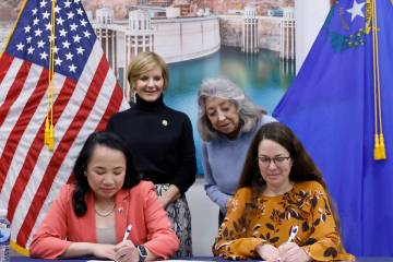 U.S. Rep. Susie Lee, left, and U.S. Rep. Dina Titus watch as Bureau of Reclamation Commissioner ...