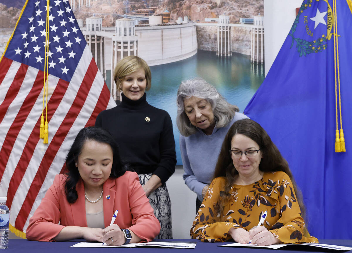 U.S. Rep. Susie Lee, left, and U.S. Rep. Dina Titus watch as Bureau of Reclamation Commissioner ...