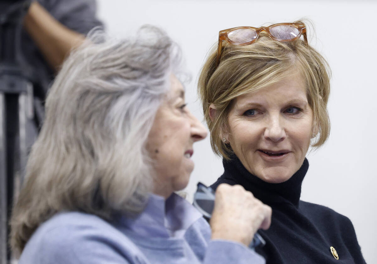 U.S. Rep. Dina Titus, left and U.S. Rep. Susie Lee chat before speaking at a news conference to ...