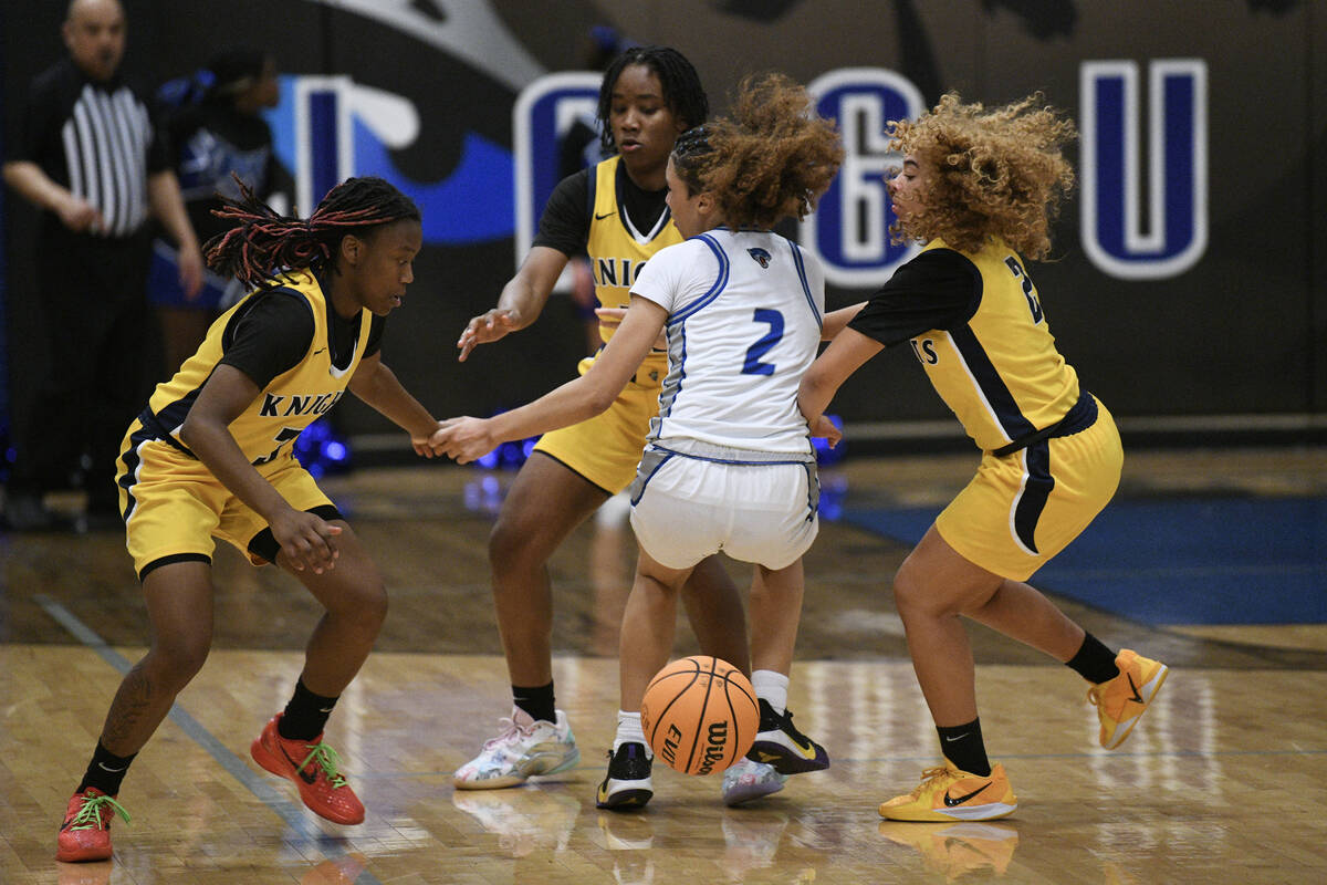 Democracy Prep’s Bray’ana Miles, left, La’niah Hicks and Aryana Edwards force Desert Pine ...