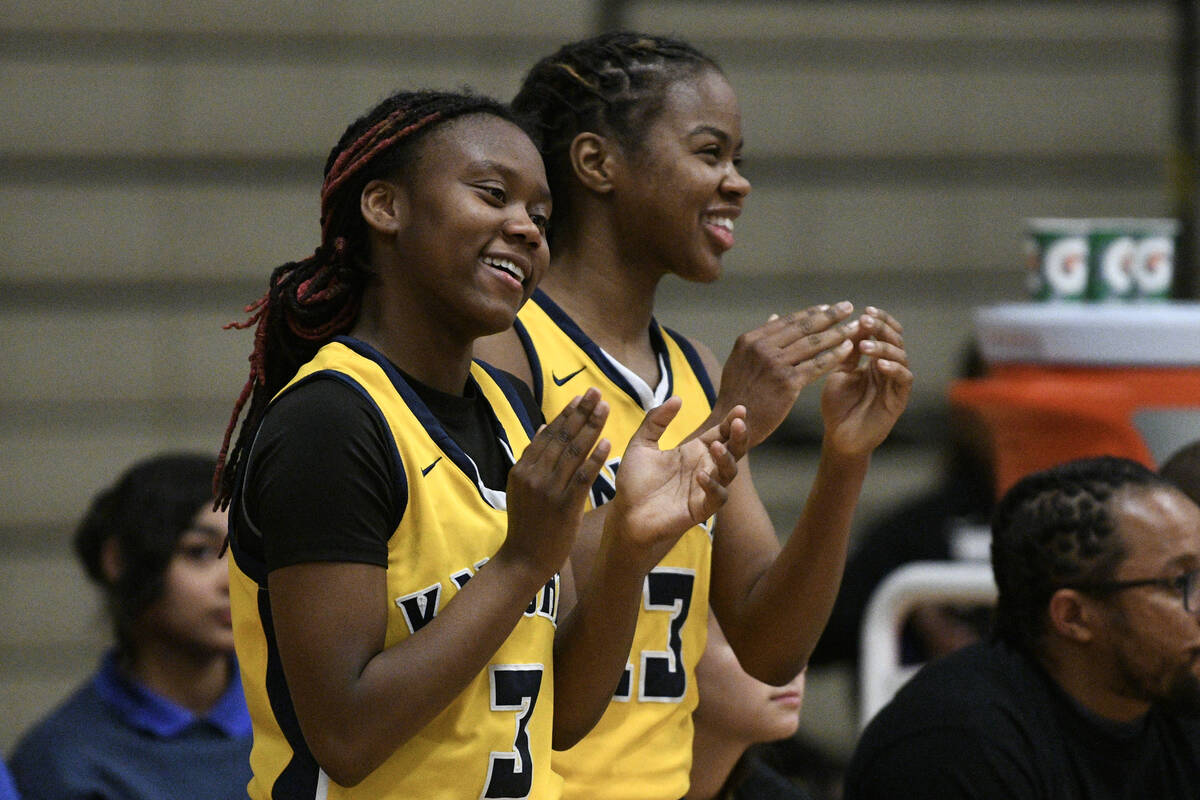 Democracy Prep's Bray’ana Miles and Keonni Lewis cheer on their teammates during their NIAA b ...