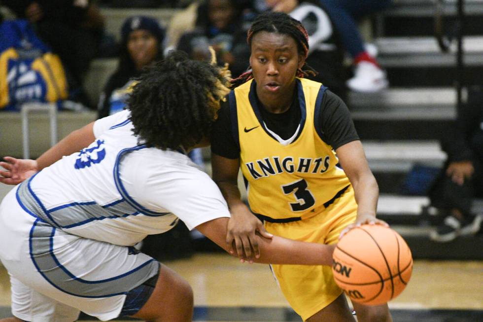 Desert Pines' Ashanti Stewart dries to defend Democracy Prep's Bray’ana Miles during their NI ...