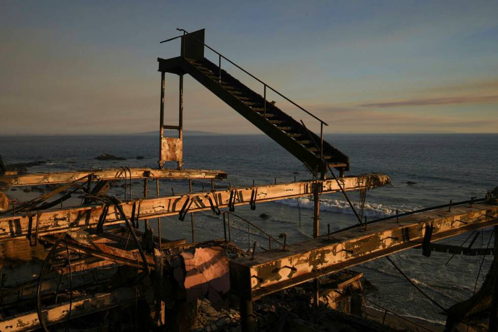 A burnt staircase stands on a building destroyed by the Palisades Fire in Malibu, Calif., Frida ...