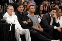 Las Vegas Aces owner Mark Davis, center left, sits next to NFL superstar Tom Brady during the f ...