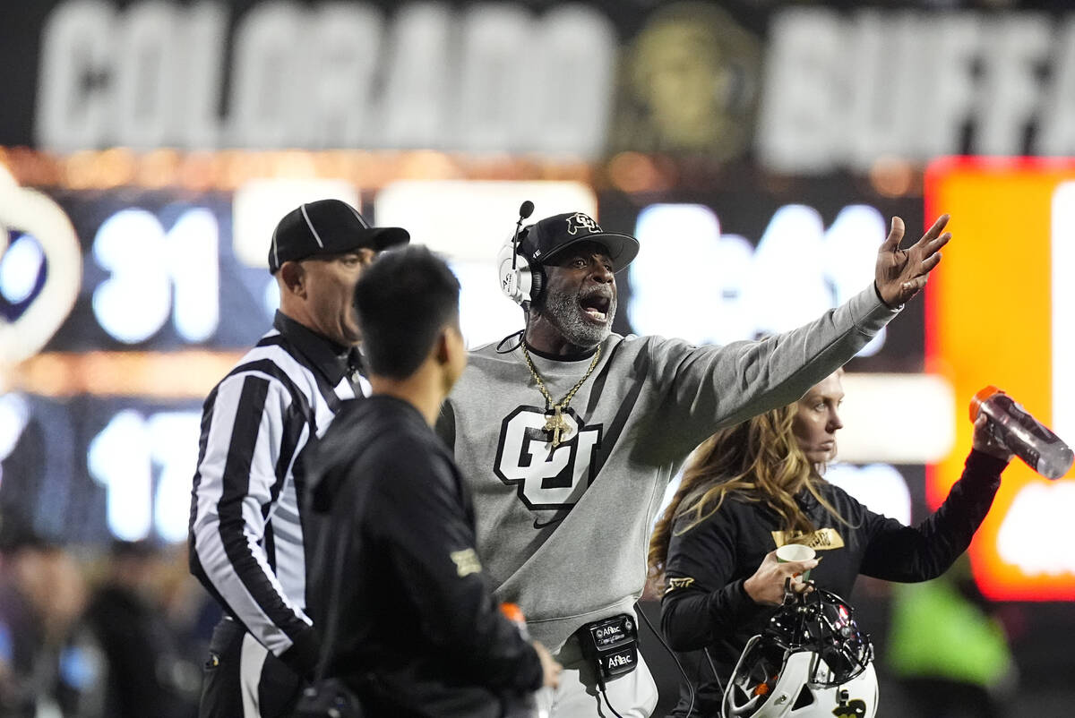 Colorado head coach Deion Sanders argues for a call in the second half of an NCAA college footb ...