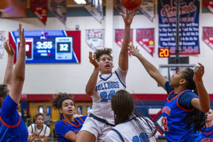 Centennial forward Nation Williams (24) elevates for a shot over Bishop Gorman center Aubrey Jo ...