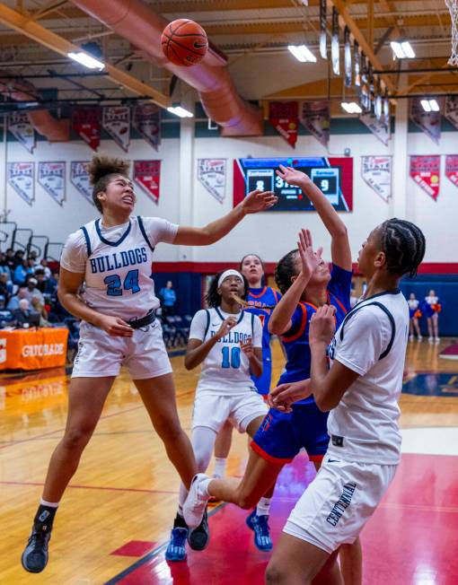 Centennial forward Nation Williams (24) battles for a rebound with Bishop Gorman guard Addysen ...