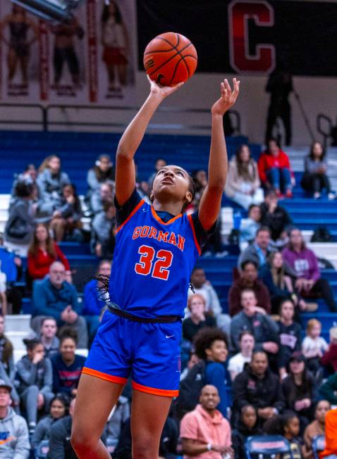 Bishop Gorman center Aubrey Johnson (32) lays up the ball against Centennial during the first h ...