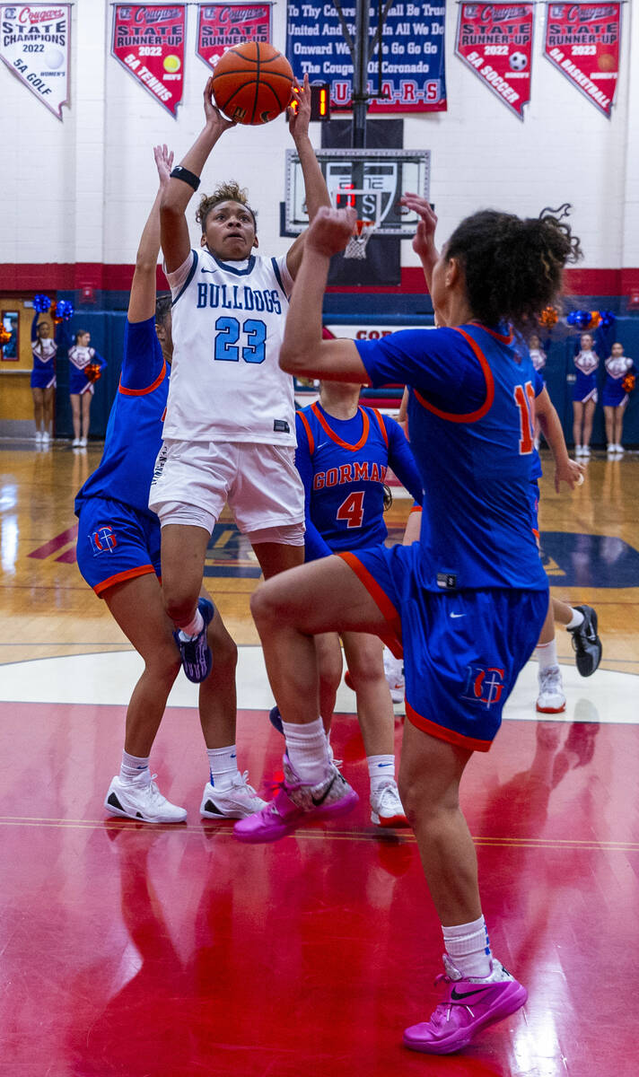 Centennial forward Damoni Poole (23) shoots while covered by Bishop Gorman's guard Aaliah Spaig ...