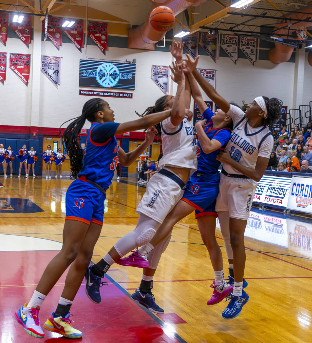 Bishop Gorman center Aubrey Johnson (32), Centennial forward Ayla Williams (12), Bishop Gorman ...