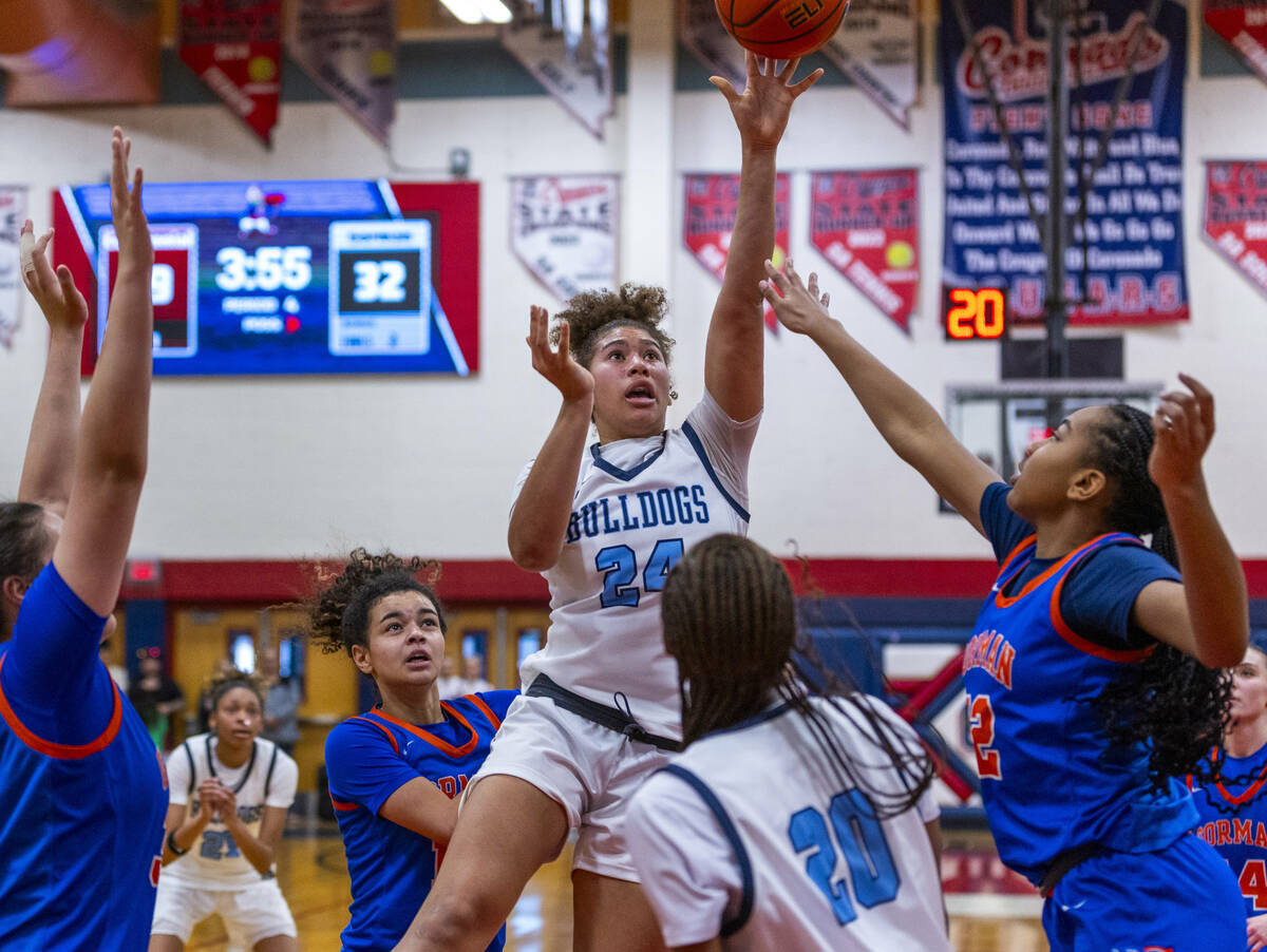 Centennial forward Nation Williams (24) elevates for a shot over Bishop Gorman center Aubrey Jo ...